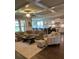 Bright open-concept living room with hardwood floors and plenty of comfortable seating at 2159 Holland Creek Ln, Buford, GA 30519