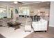 Open-concept living room with dining and kitchen features hardwood floors and neutral decor at 2159 Holland Creek Ln, Buford, GA 30519