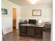 Office space featuring a large wooden desk and dark wood floors at 2159 Holland Creek Ln, Buford, GA 30519