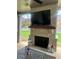 Outdoor fireplace providing a cozy setting for outdoor entertaining and relaxation at 2159 Holland Creek Ln, Buford, GA 30519