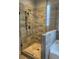 Detailed shot of a walk-in shower with tile surround, featuring updated fixtures and glass surround at 2159 Holland Creek Ln, Buford, GA 30519