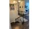 Staircase with wooden steps and black iron railing that leads to the upper level at 2159 Holland Creek Ln, Buford, GA 30519