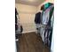 Walk-in closet with wire shelving providing ample storage space for clothing and accessories at 2159 Holland Creek Ln, Buford, GA 30519