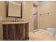 Bathroom with vanity and walk-in shower featuring neutral earth-tone color palette at 3487 Binghurst Rd, Suwanee, GA 30024