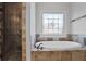 Bathroom with soaking tub, walk-in shower, and decorative glass window detail at 3487 Binghurst Rd, Suwanee, GA 30024