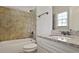 Elegant bathroom with granite counters, stylish tile surround on the tub/shower and modern fixtures at 3487 Binghurst Rd, Suwanee, GA 30024