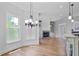 Breakfast area with wood floors, large windows, and a chandelier at 3487 Binghurst Rd, Suwanee, GA 30024