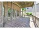 Large covered deck provides shade and space for entertaining with brick exterior views at 3487 Binghurst Rd, Suwanee, GA 30024