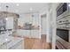Spacious kitchen with stone backsplash, granite countertops, and stainless steel appliances at 3487 Binghurst Rd, Suwanee, GA 30024