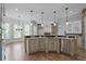 Kitchen with granite counters, hardwood floors, large sink with faucet, and open floorplan at 3487 Binghurst Rd, Suwanee, GA 30024
