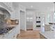 Spacious kitchen with stainless appliances, granite countertops, and hardwood floors at 3487 Binghurst Rd, Suwanee, GA 30024