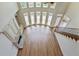 Open floor plan with fireplace, and floor to ceiling windows which provides an abundance of natural light at 3487 Binghurst Rd, Suwanee, GA 30024