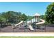 Fun-filled community playground with slides and climbing structures, perfect for outdoor adventures at 3487 Binghurst Rd, Suwanee, GA 30024