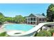 Resort-style pool with waterslide, clubhouse and ample seating, perfect for relaxation and community fun at 3487 Binghurst Rd, Suwanee, GA 30024