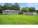 Wide open and very spacious backyard with the house, deck and detached garage in view at 3551 Clay Rd, Austell, GA 30106