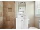 Neutral bathroom features a tiled shower and a white vanity with a large mirror at 3551 Clay Rd, Austell, GA 30106