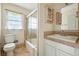 Tiled bathroom featuring a shower and a toilet at 3551 Clay Rd, Austell, GA 30106