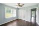 Well lit bedroom with a ceiling fan, closet and a window at 3551 Clay Rd, Austell, GA 30106