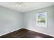 This bedroom has hardwood floors, neutral walls, and a window for natural light at 3551 Clay Rd, Austell, GA 30106