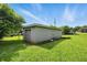 View of detached garage and part of backyard on a sunny day at 3551 Clay Rd, Austell, GA 30106