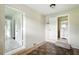 Wide shot of hallway with view to tiled entry and white brick walls at 3551 Clay Rd, Austell, GA 30106