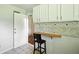 Bright kitchen with white cabinets and backsplash, and a small dining area that exits to the backyard at 3551 Clay Rd, Austell, GA 30106