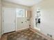 Mud room features a brick wall and tile flooring at 3551 Clay Rd, Austell, GA 30106