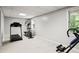 Finished basement exercise room, with carpeted floors and natural light at 6065 Ashbury Ln, Cumming, GA 30028