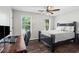 Bedroom with a Queen bed, a desk setup and windows with natural light at 6065 Ashbury Ln, Cumming, GA 30028