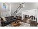 Bright living room flows into the dining area and kitchen, offering a versatile and connected living space at 6065 Ashbury Ln, Cumming, GA 30028