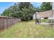 Spacious backyard with a well-kept lawn, wood fence and shaded patio, great for outdoor activities at 161 Brasch Park Dr, Grantville, GA 30220