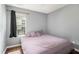 Cozy bedroom with grey walls and hardwood floors offers comfortable living space at 161 Brasch Park Dr, Grantville, GA 30220