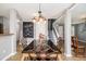 Dining area with modern light fixture and stairs leading to the upper floor at 161 Brasch Park Dr, Grantville, GA 30220