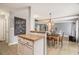 Open dining area with adjacent kitchen island, perfect for entertaining guests at 161 Brasch Park Dr, Grantville, GA 30220