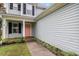 Charming two-story home with a soft pink door and manicured lawn at 161 Brasch Park Dr, Grantville, GA 30220