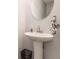 Elegant half bath featuring a pedestal sink and modern fixtures at 161 Brasch Park Dr, Grantville, GA 30220