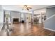 Open living room and kitchen area with fireplace and modern decor at 161 Brasch Park Dr, Grantville, GA 30220