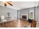 Cozy living room with a stone fireplace and neutral color palette at 161 Brasch Park Dr, Grantville, GA 30220