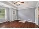 Spacious main bedroom with trey ceiling, hardwood floors, and natural light at 161 Brasch Park Dr, Grantville, GA 30220