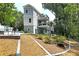 Inviting backyard design, features a multi-level deck, seating area, and landscaping for outdoor enjoyment at 2125 Clay Rd, Austell, GA 30106