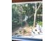 Scenic backyard with a stone patio, fire pit, and landscaped path leading to a peaceful outdoor oasis at 2125 Clay Rd, Austell, GA 30106