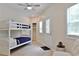 Bedroom with bunkbeds, closet and an outside door with windows at 2125 Clay Rd, Austell, GA 30106