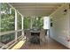 Spacious outdoor deck with seating and a view of the surrounding trees and natural light at 2125 Clay Rd, Austell, GA 30106