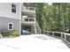 Multi-level deck provides outdoor enjoyment and staircase complements the home's modern exterior design at 2125 Clay Rd, Austell, GA 30106