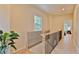 Hallway with stairs, a window, and a view into one of the home's bedroom at 2125 Clay Rd, Austell, GA 30106