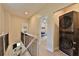 Upstairs hallway with washer and dryer units, and view into the bedroom with bunkbeds at 2125 Clay Rd, Austell, GA 30106