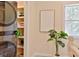 Upstairs hallway laundry machine and view of closet shelving at 2125 Clay Rd, Austell, GA 30106