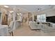 Open concept living room with hardwood floors, kitchen, and view of the stairs to the second floor at 2125 Clay Rd, Austell, GA 30106
