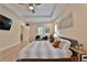 Relaxing main bedroom features a ceiling fan, tray ceiling, and plenty of natural light at 2125 Clay Rd, Austell, GA 30106