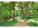 Picturesque path leading to a serene pond with lush greenery offering a peaceful outdoor setting at 2125 Clay Rd, Austell, GA 30106